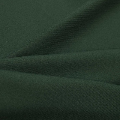 Ткань костюмная 21010 2076, 225 гр/м2, шир.150см, цвет т.зеленый - купить в Камышине. Цена 390.73 руб.